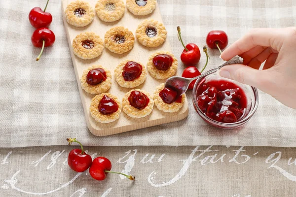 Puff pastry cookies filled with cherries — Stock Photo, Image