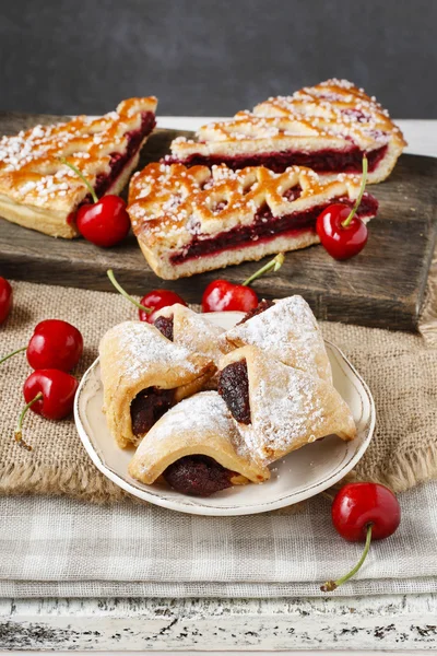 Puff pastry cookies filled with cherries — Stock Photo, Image