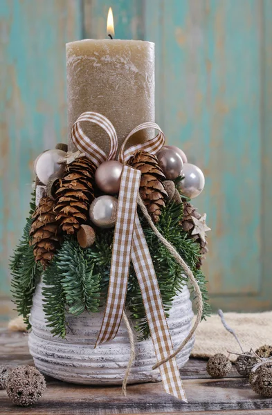 Christmas decoration with candle and cones — Stock Photo, Image