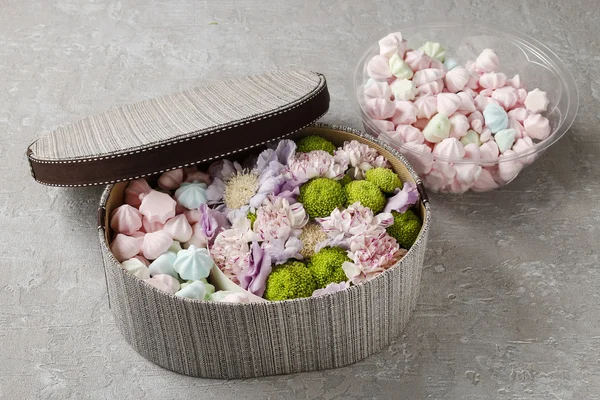 Box of sweets and flowers — Stock Photo, Image