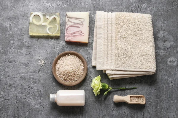 Spa set: liquid soap, bars of handmade soap, sea salt and towel. — Stock Photo, Image