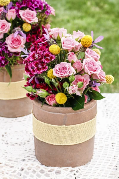 Romantic floral arrangement with roses and carnations