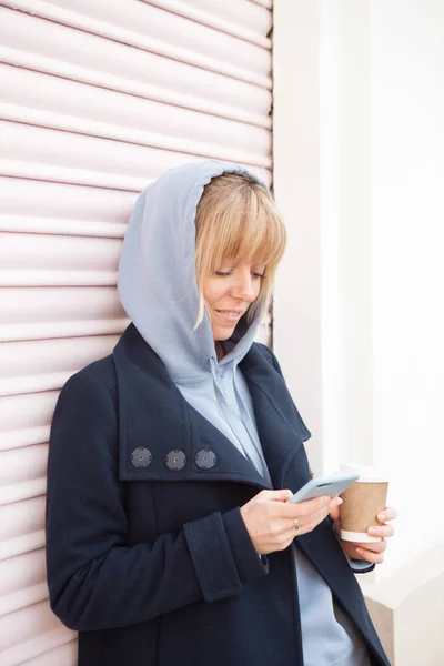 Cute Blond Girl Blue Hoodie Using Smartphone Application Rent Moto — Foto de Stock