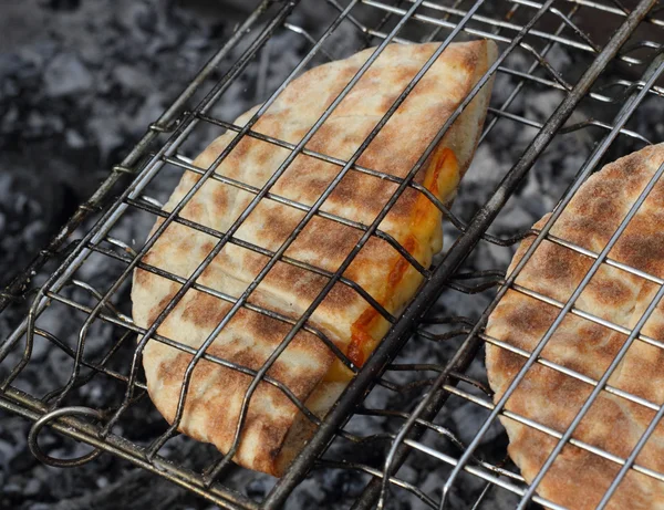 Roasted arabic bread pita on the grill closeup — Stock Photo, Image