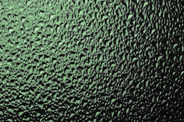 Surface en verre ondulé teinté vert — Photo
