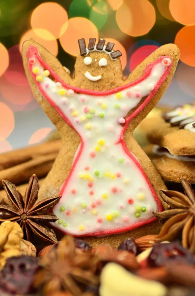 Delicious decorated Christmas cookies on bokeh background — Stock Photo, Image