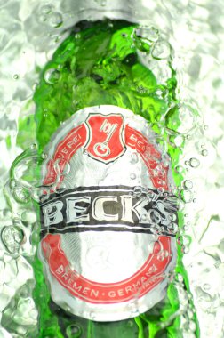 Becks beer in splashed water clipart