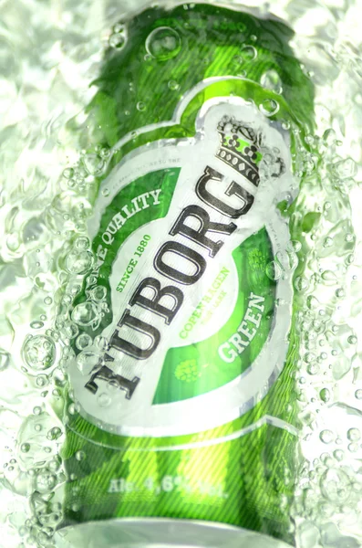 Tuborg beer in splashed water — Stock Photo, Image