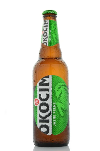 Okocim full light beer isolated on white background — Stock Photo, Image