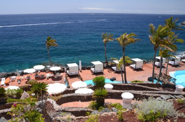 Picturesque beach club in Costa Adeje on Tenerife island in spain clipart