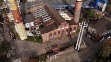 Arial view on Front of brick main building of historical coal mine: Kopalnia Wujek with with the name on wall. Katowice / Poland - 09.2020. 4K, UHD, Cinematic, Aerial footage