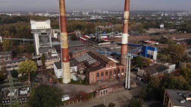 Arial view on Front of brick main building of historical coal mine: Kopalnia Wujek with with the name on wall. Katowice / Poland - 09.2020. 4K, UHD, Cinematic, Aerial footage