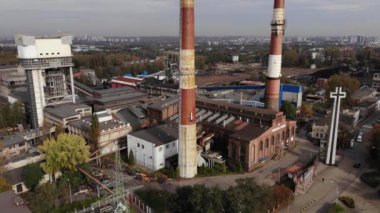 Arial view on Front of brick main building of historical coal mine: Kopalnia Wujek with with the name on wall. Katowice / Poland - 09.2020. 4K, UHD, Cinematic, Aerial footage