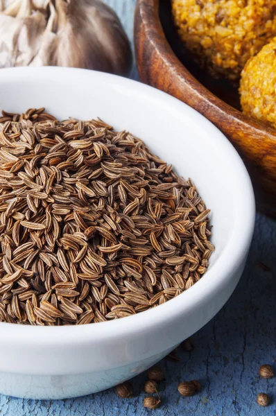 Cumin seeds in a white bowl — Stock Photo, Image