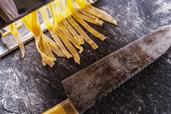 Homemade pasta dough is being processed — Stock Photo, Image