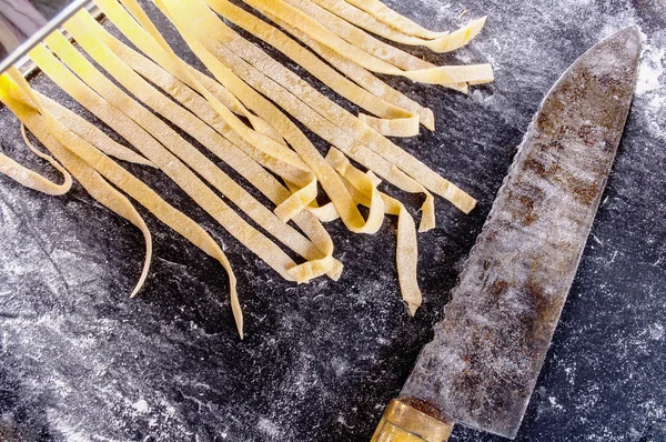 Homemade pasta dough is being processed — Stock Photo, Image