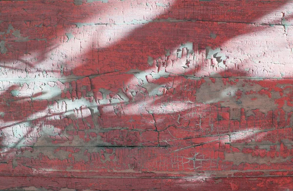 Rustic wood texture with fading red paint — Stock Photo, Image