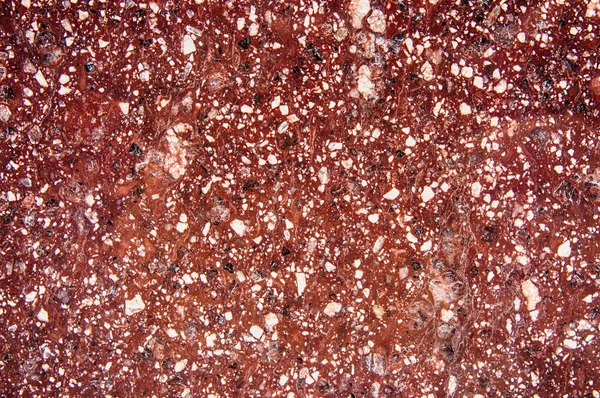 Закрыть полированным красным мраморным гранитом текстуру — стоковое фото