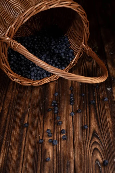Blueberries Wicker Basket Wooden Board Low Key — Stock Photo, Image
