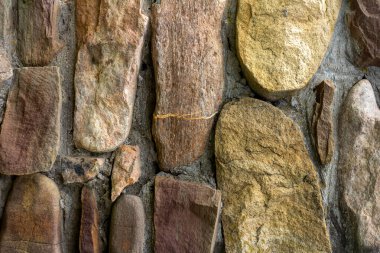 Çalışan tasarım için taş duvar arkaplanı, çeşitli çözümler ve yapılar, üst açı, yakın çekim.