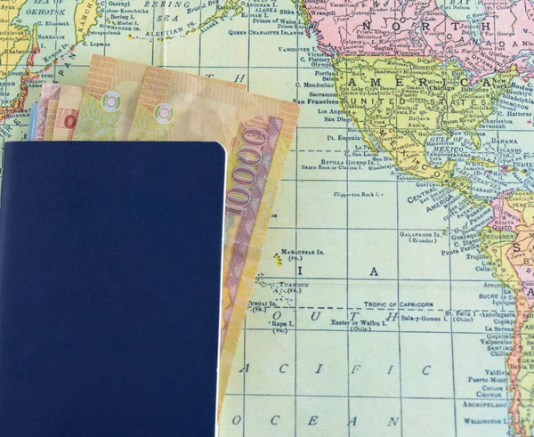 passport with money on world map background