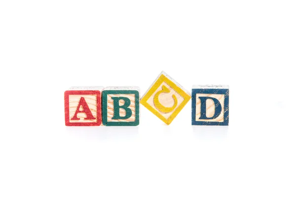 Foto de un alfabeto bloques ortografía ABCD aislar en blanco backgr — Foto de Stock