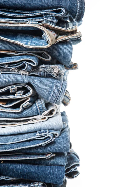 Stack of jeans on white background — Stock Photo, Image