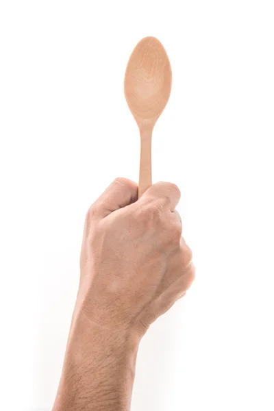 Uomini mano tenendo cucchiaio di legno su sfondo bianco — Foto Stock