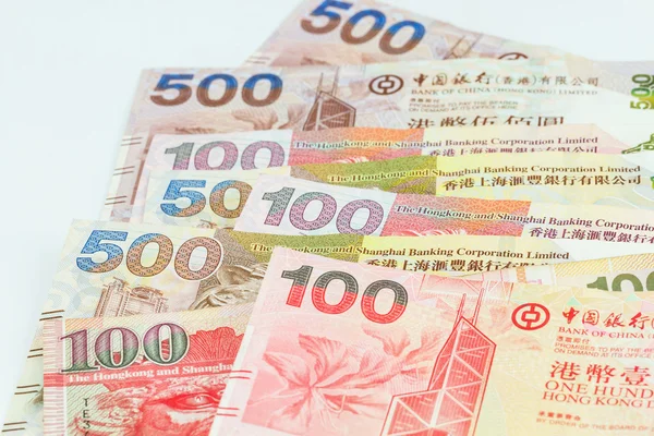 Гонконгские доллары на белом фоне — стоковое фото