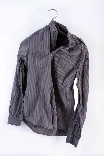 Grunge shirt on a hanger isolated — Stock Photo, Image