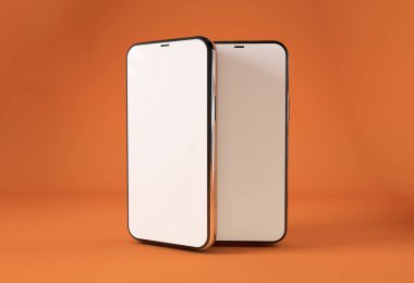 Turuncu arkaplanda boş ekranı olan iki akıllı telefon.