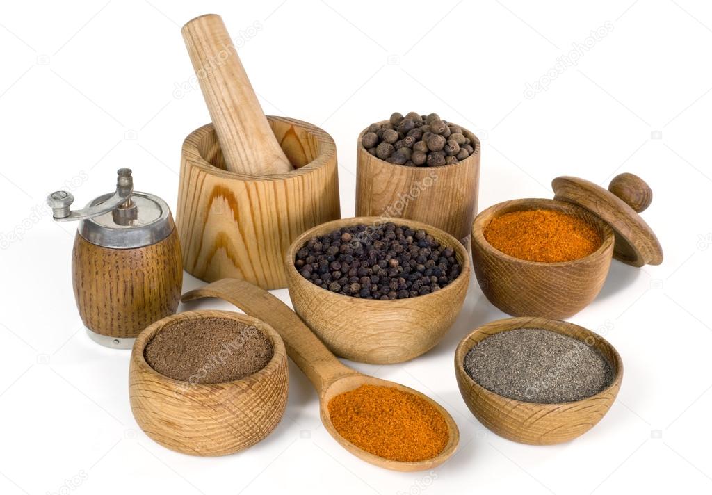 spices and seasoning in wooden bowl on white background