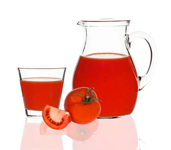 Tomato juice in glass and carafe — Stock Photo, Image