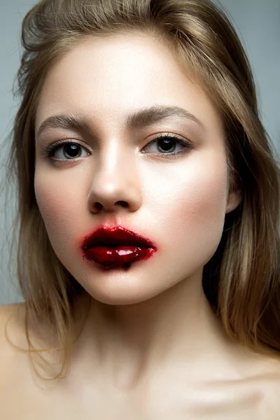 Portrait of a young girl with a creative make-up — Stock fotografie