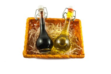 Two bottles of wine vinegar and olive oil in a gift box clipart