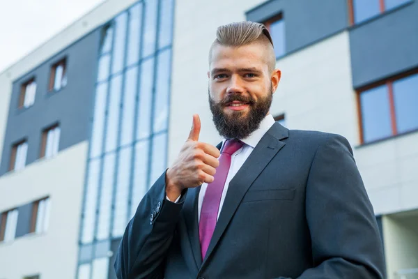 Portrait of a young happy businessman. Thumb up. Positive emotio — Stock Photo, Image