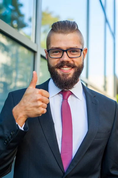 Portrait of a young happy businessman. Thumb up. Positive emotio — Stock Photo, Image