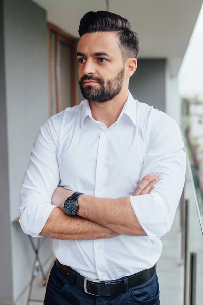 Portrait of a young businessman in a white shirt with arms cross — Stock Photo, Image