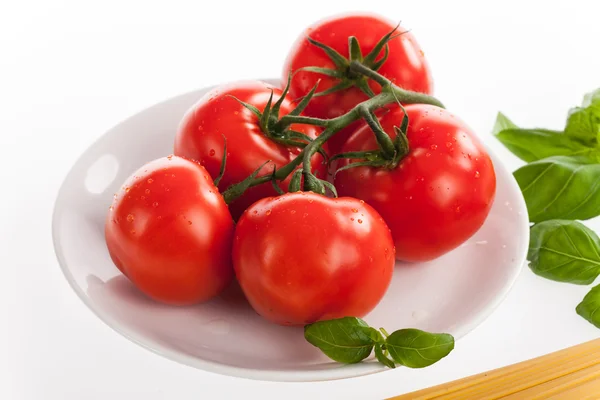 Fresh red tomatoes with drops of water — Stock Photo, Image