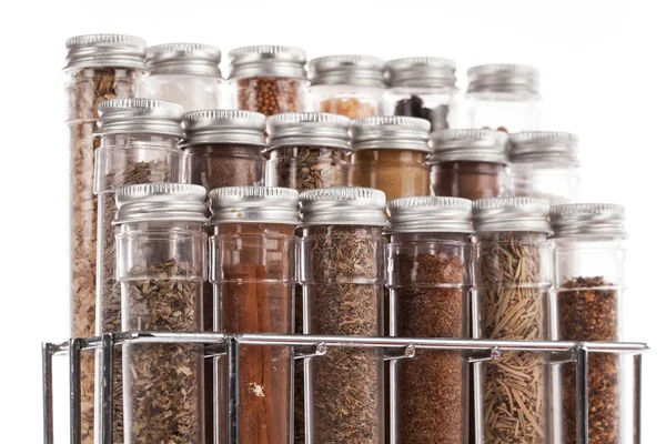 Assorted ground spices in bottles — Stock Photo, Image