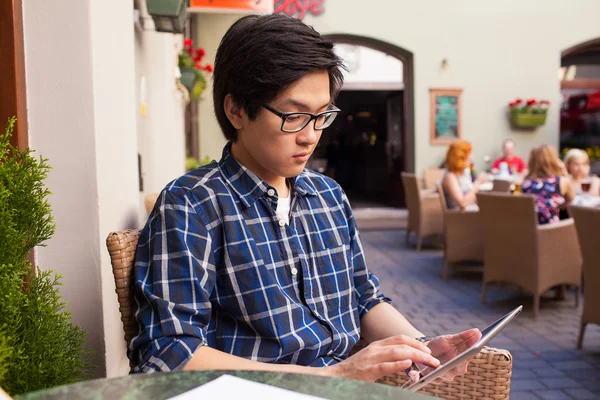 Asian student with digital tablet — Stock Photo, Image