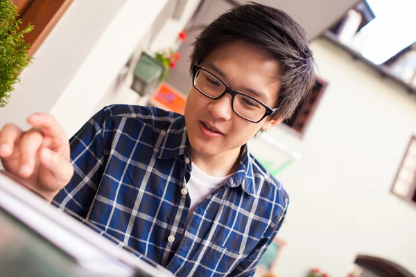 Asian student with digital tablet — Stock Photo, Image