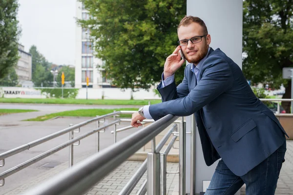 Businessman talking by phone — Stock Photo, Image