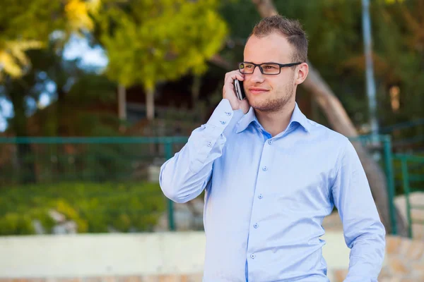 Young tourist with mobile phone — Stock Photo, Image