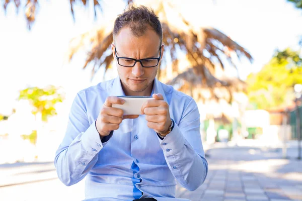 Young tourist with mobile phone — Stock Photo, Image