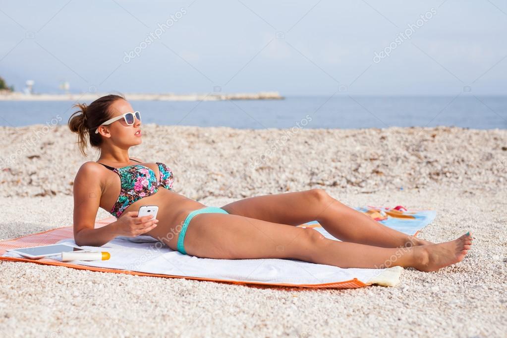 Nude Girl Sun Tanning On Beach