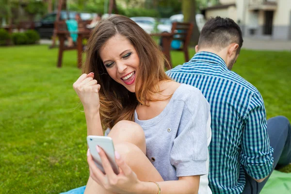 Couple sitting on the blanket — Stock Photo, Image