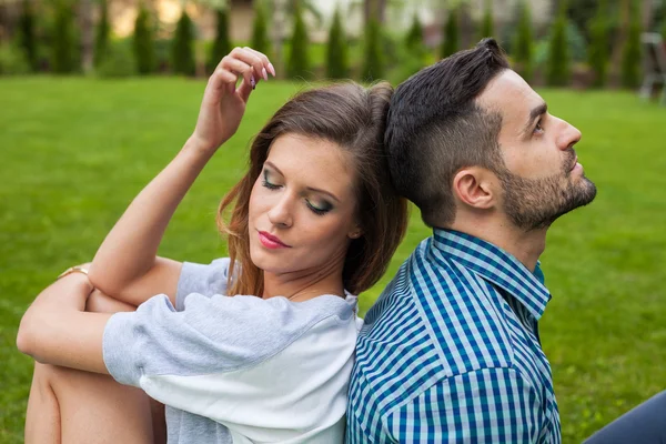 Couple sitting on the blanket — Stock Photo, Image