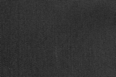 Koyu plastik bir kumaşın yakın çekim dokusu.