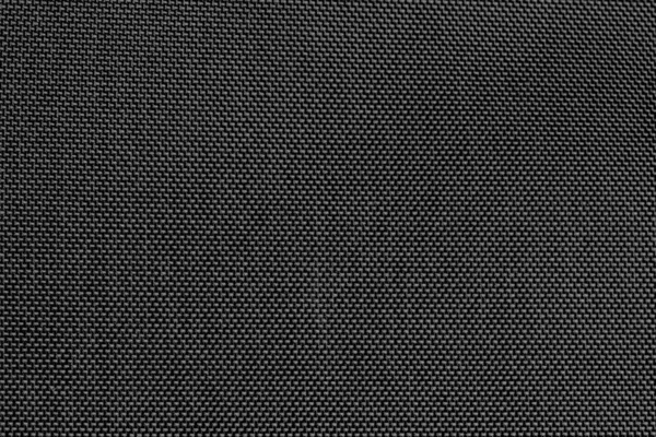Koyu plastik bir kumaşın yakın çekim dokusu.